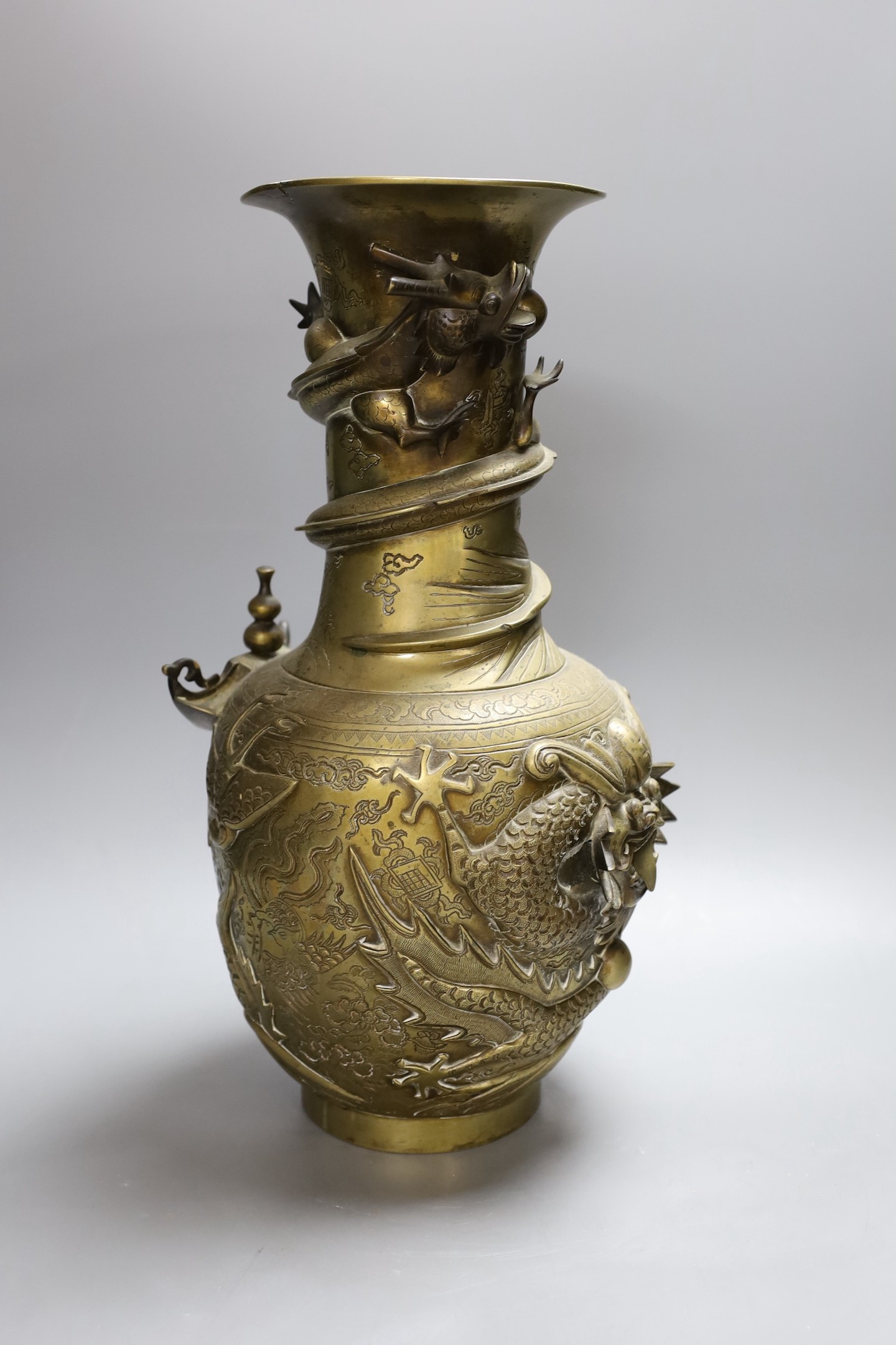 An early 20th century Chinese cast and engraved bronze vase, 42cm